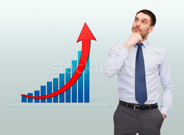 thinking young businessman with growth chart Stock photo © dolgachov