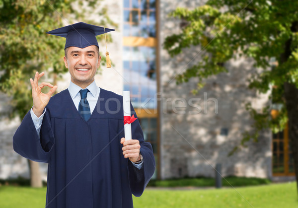 Sonriendo adulto estudiante diploma educación graduación Foto stock © dolgachov