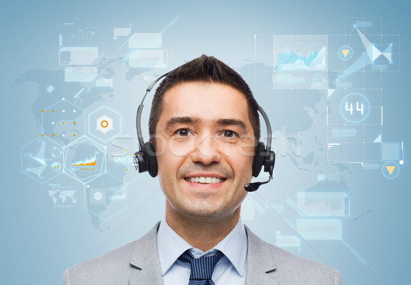 smiling businessman in headset Stock photo © dolgachov