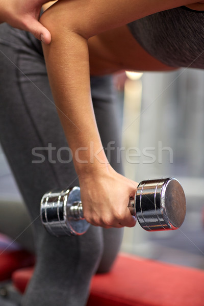 close up of couple with dumbbell exercising in gym Stock photo © dolgachov
