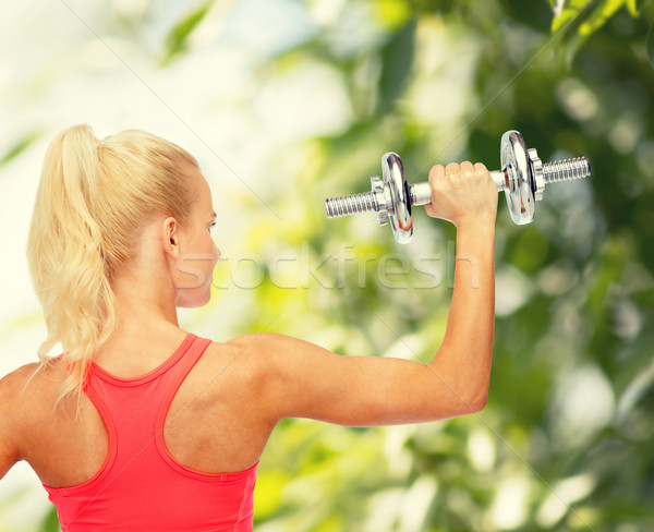 Vrouw zwaar staal Maakt een reservekopie Stockfoto © dolgachov