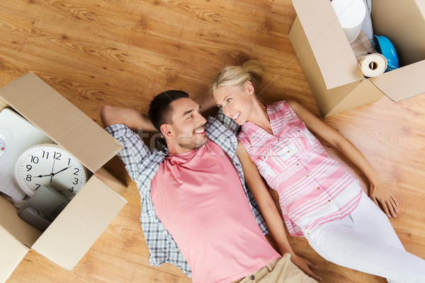 couple with big cardboard boxes moving to new home Stock photo © dolgachov