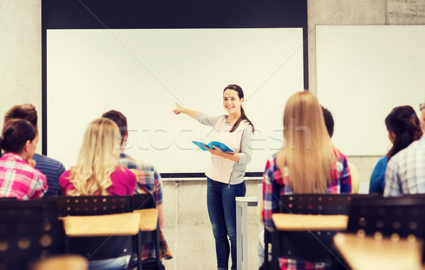 group of smiling students in classroom Stock photo © dolgachov