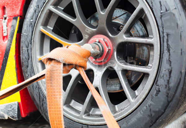 close up of race car wheel with tow rope tied to Stock photo © dolgachov