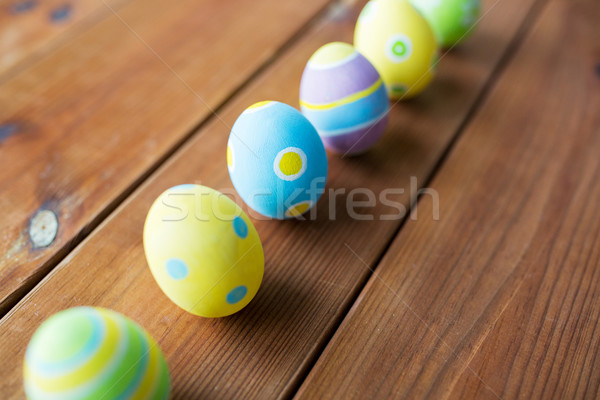 Közelkép színes húsvéti tojások fából készült felület húsvét Stock fotó © dolgachov