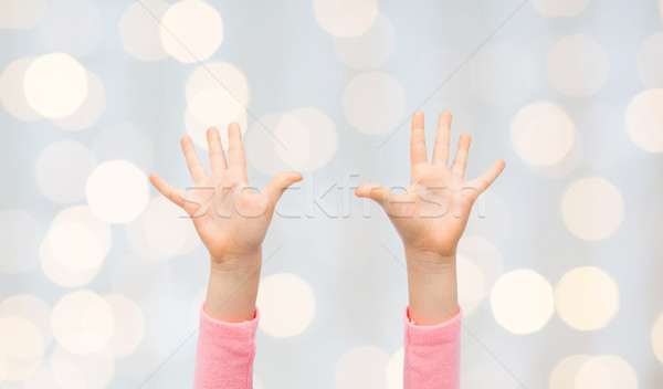 close up of little child hands raised upwards Stock photo © dolgachov