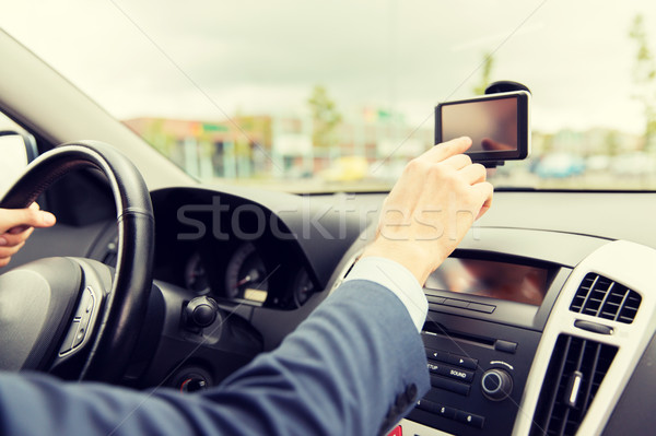 close up of man with gps navigator driving car Stock photo © dolgachov