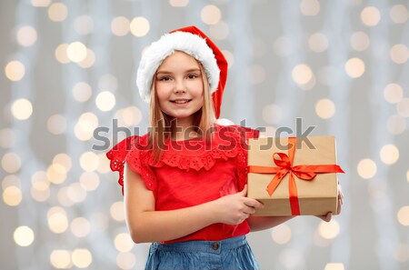 beautiful sexy woman in santa hat with gift box Stock photo © dolgachov
