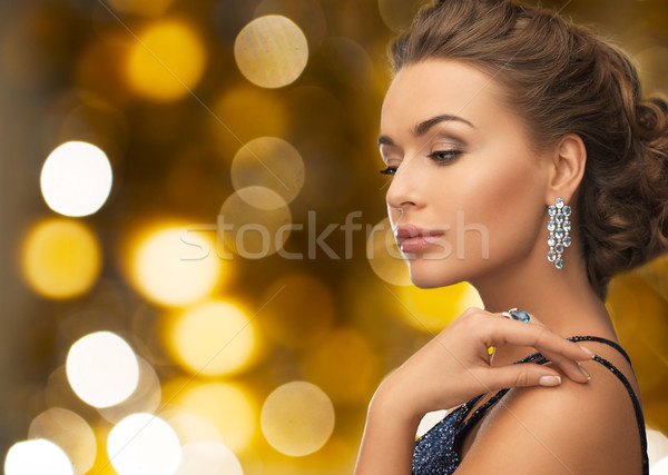 woman in evening dress and diamond earring Stock photo © dolgachov
