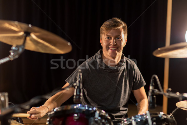 Stock photo: male musician playing drums and cymbals at concert