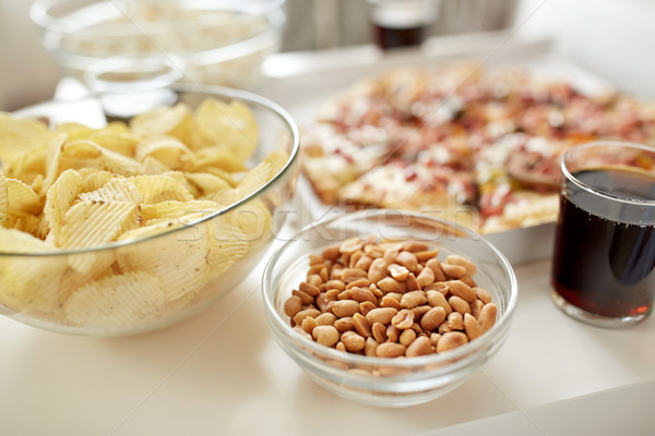 close up of fast food snacks and drink on table Stock photo © dolgachov