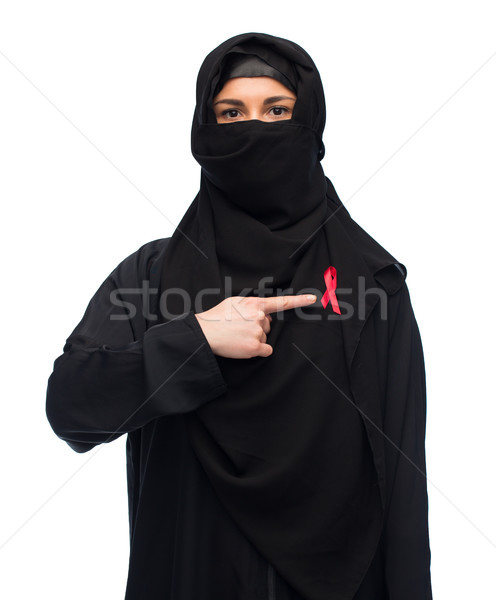 muslim woman in hijab with red awareness ribbon Stock photo © dolgachov