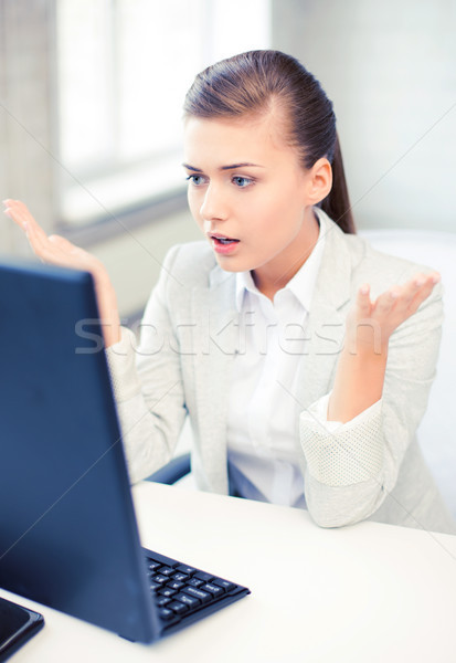 Stock photo: stressed student with computer in office