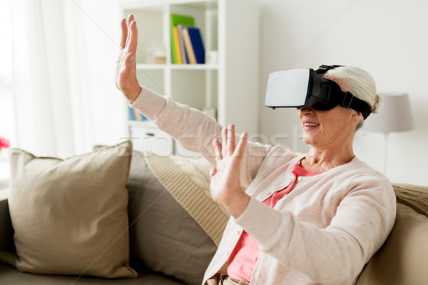 Stock photo: old woman in virtual reality headset or 3d glasses