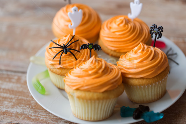 halloween party decorated cupcakes on plate Stock photo © dolgachov