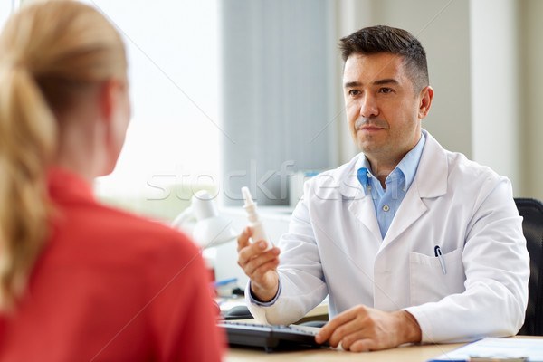 doctor with nasal spray and patient at hospital Stock photo © dolgachov