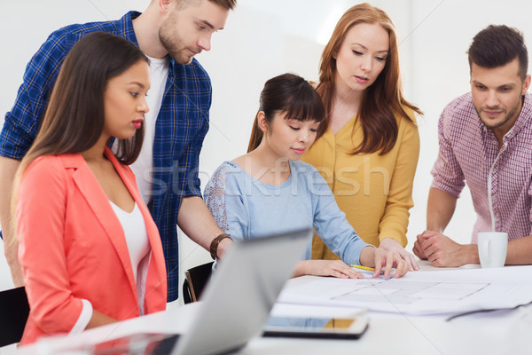 creative team with blueprint working at office Stock photo © dolgachov