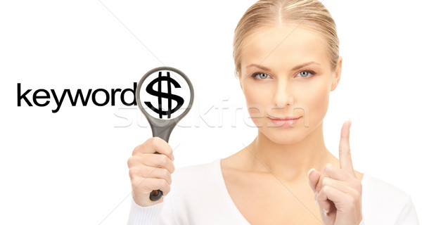 woman with magnifying glass and keywords word Stock photo © dolgachov