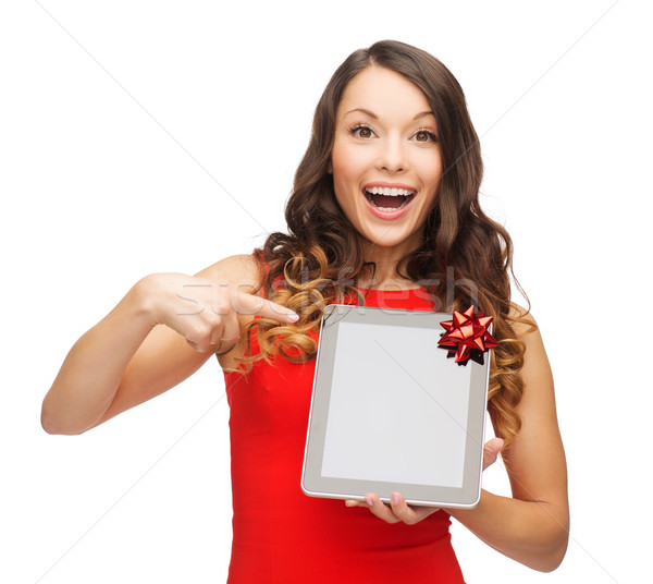 smiling woman in red dress with tablet pc Stock photo © dolgachov