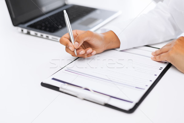 female doctor writing prescription Stock photo © dolgachov