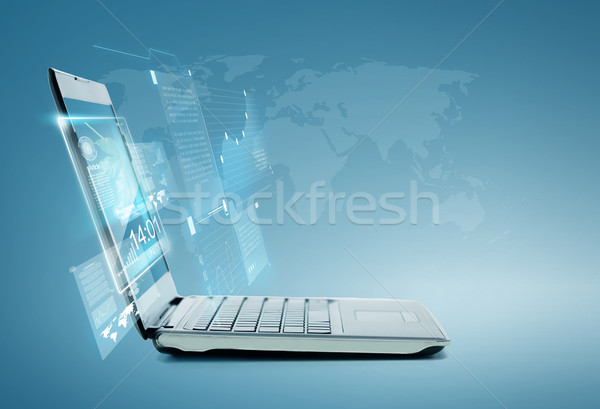 laptop computer with chart and graphs on screen Stock photo © dolgachov
