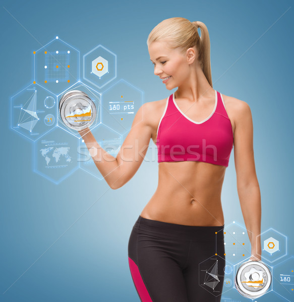 smiling woman lifting steel dumbbell Stock photo © dolgachov