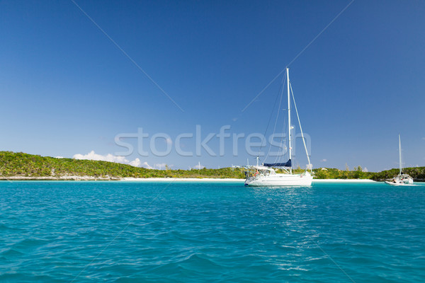 white boat at blue sea Stock photo © dolgachov