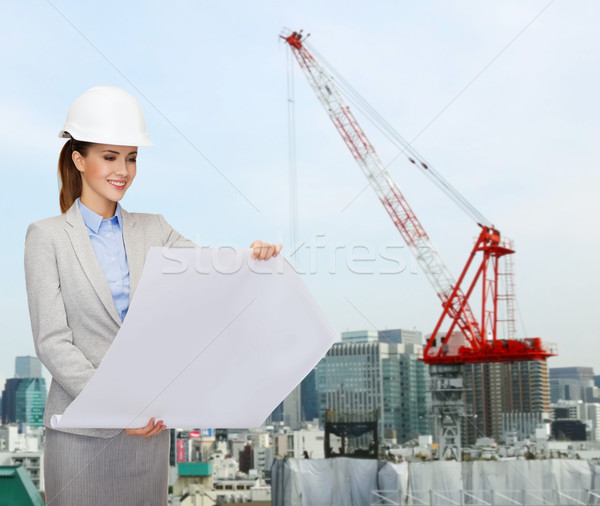 Zakenvrouw witte helm blauwdruk gebouw ontwikkelen Stockfoto © dolgachov