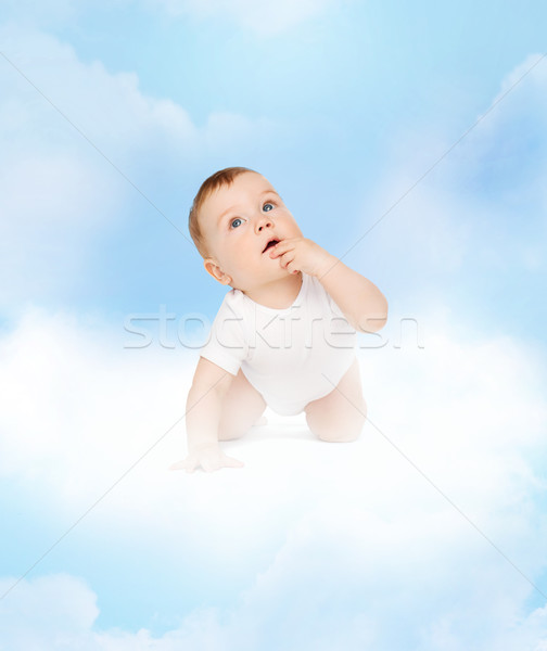 crawling curious baby looking up Stock photo © dolgachov