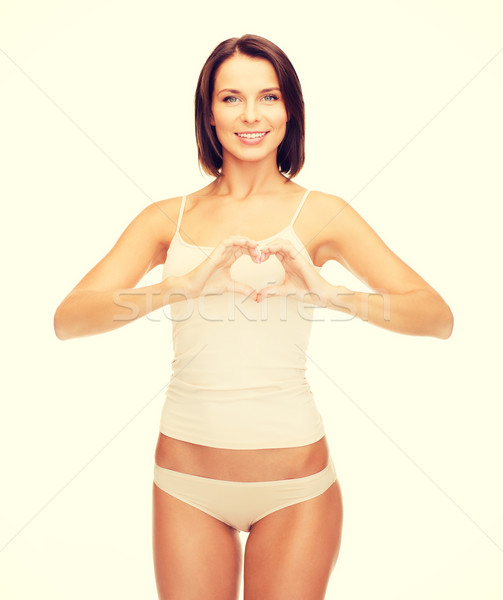 woman forming heart shape Stock photo © dolgachov