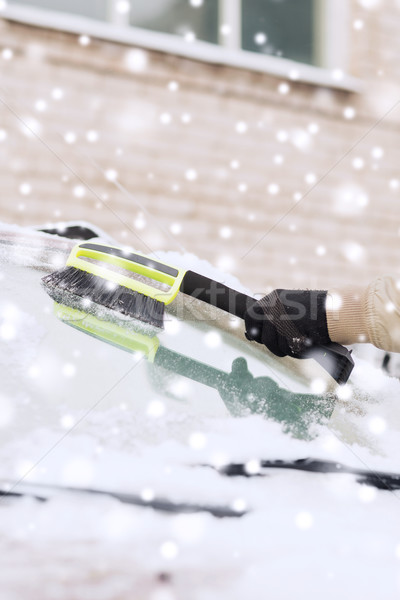 closeup of man cleaning snow from car Stock photo © dolgachov