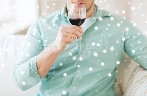 close up of man drinking red wine at home Stock photo © dolgachov