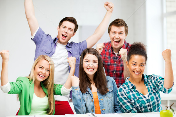 Studentów trzymając się za ręce w górę szkoły edukacji szczęśliwy Zdjęcia stock © dolgachov
