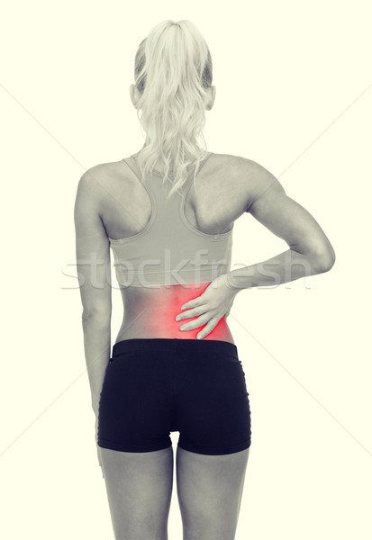 Vrouw aanraken Maakt een reservekopie fitness gezondheidszorg Stockfoto © dolgachov
