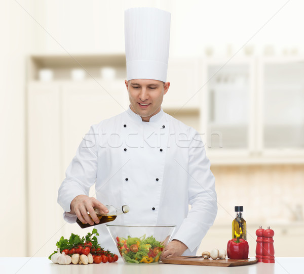 Szczęśliwy mężczyzna kucharz gotować gotowania żywności Zdjęcia stock © dolgachov