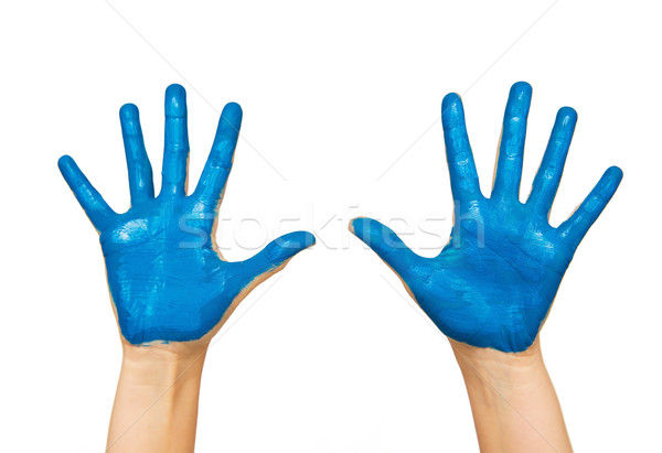 human hands painted with blue color Stock photo © dolgachov