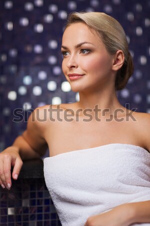 happy womani sitting in jacuzzi at poolside Stock photo © dolgachov