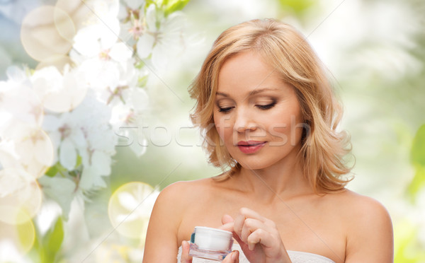middle aged woman with cream jar Stock photo © dolgachov