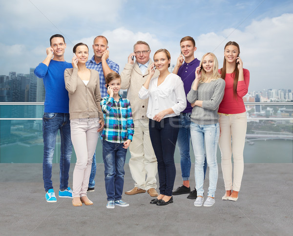 group of smiling people with smartphones Stock photo © dolgachov