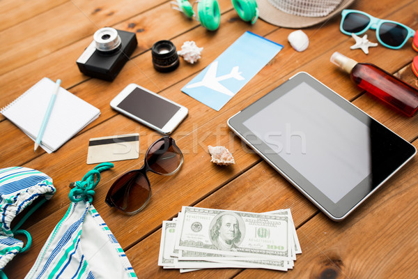 close up of tablet pc and travel stuff Stock photo © dolgachov