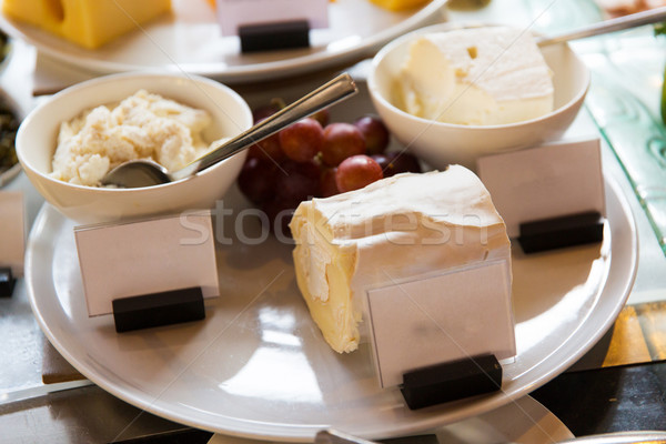 close up of cheese on showcase at cafe Stock photo © dolgachov