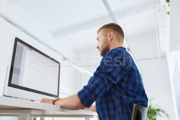 creative man or programmer with computer at office Stock photo © dolgachov