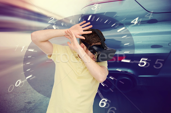 man in virtual reality headset and car racing game Stock photo © dolgachov