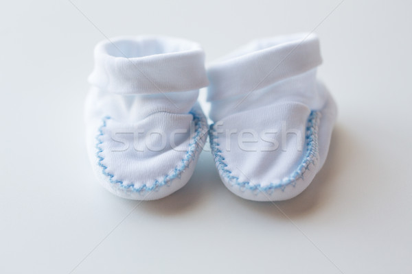 close up of white baby bootees for newborn boy Stock photo © dolgachov