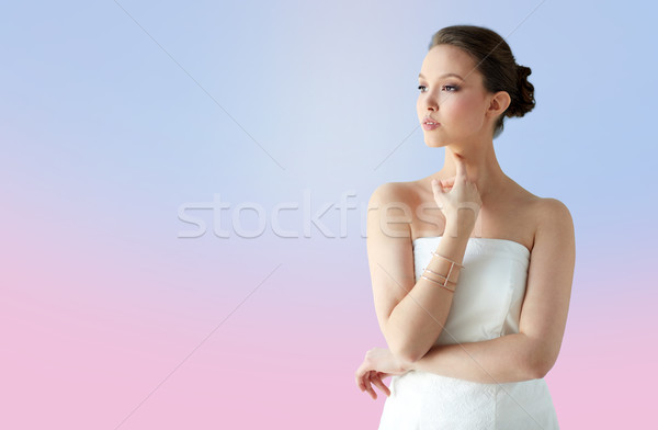 Belle asian femme or bracelet beauté Photo stock © dolgachov