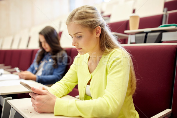 student girls with smartphones on lecture Stock photo © dolgachov