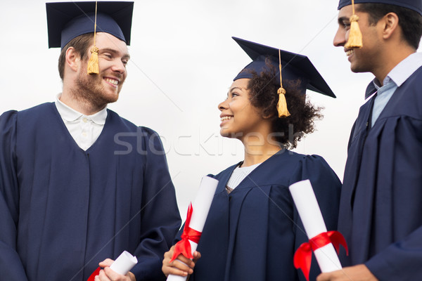 Szczęśliwy studentów edukacji ukończeniu ludzi grupy Zdjęcia stock © dolgachov