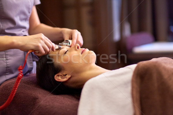 woman having hydradermie facial treatment in spa Stock photo © dolgachov