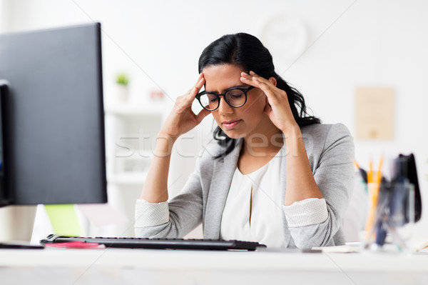 stressed businesswoman with computer at office Stock photo © dolgachov