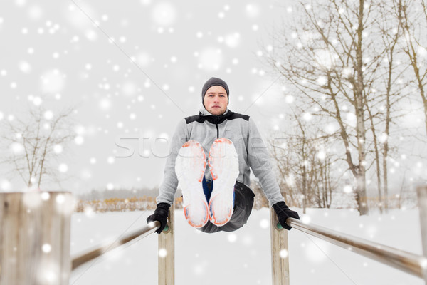 Jeune homme parallèle bars hiver fitness [[stock_photo]] © dolgachov